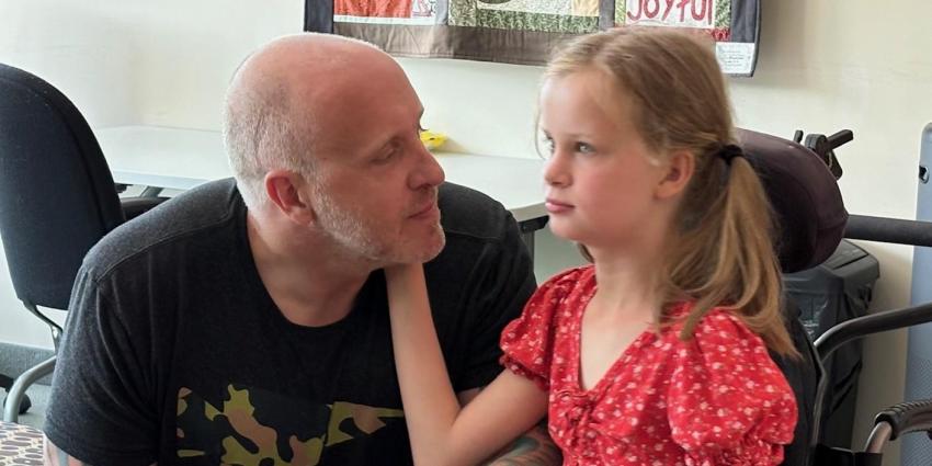 photo of dad and his daughter