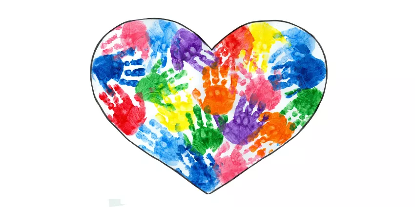 Heart shape filled with colorful overlapping handprints on a white background