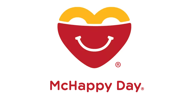 Heart-shaped smiling logo with text World Smile Day and McHappy Day below in red letters